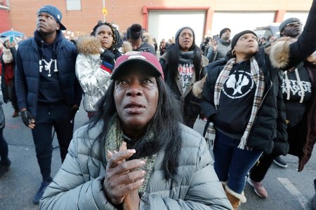 Bronx resident Catana Yehudah, 50, front, sheds tears as she hears the response of prisoners held inside the Metropolitan Detention Center. Yehudah's brother Jason Smith is currently serving 18 months inside MDC for gun possession. He has been incarcerated since June 2018. The prison has been without heat, hot water, electricity and flushing toilets for several days, including during the recent frigid cold.
