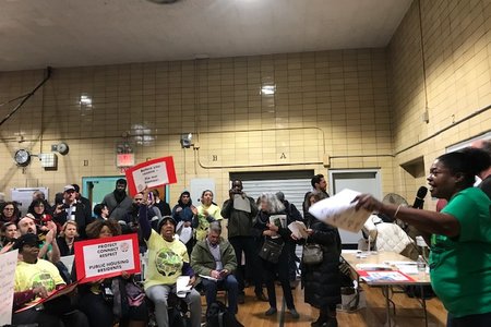 Brooklyn activists protested conditions at NYCHA during a city planning event on Wednesday night in Carroll Gardens.