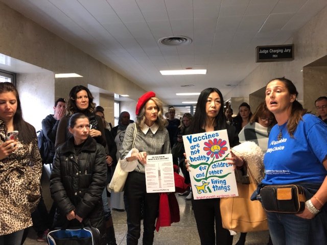 Anti-vaccination activists attend a court hearing in Brooklyn.