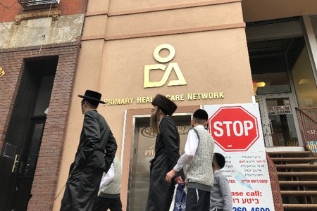 A doctor's office on Bedford Avenue in Williamsburg warns patients against entering if they have a fever, a rash or have been exposed to measles.