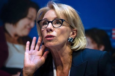 Education Secretary Betsy DeVos listens to a question during a student town hall at National Constitution Center in Philadelphia.