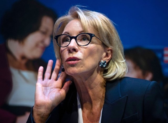 Education Secretary Betsy DeVos listens to a question during a student town hall at National Constitution Center in Philadelphia.