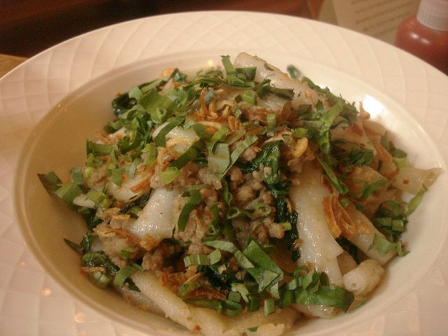 111209chang.jpg Oh thank God, another David Chang restaurant! Though Ma Peche isn't slated to open until winter, the Momofuku Gods have blessed Midtown with a lunch special at the Chambers Hotel. Ten bucks gets you your choice of two types of banh mi, bun du riz (rice noodles, pork ragout, saw leaf herb) or calamare, soda or water, and for an extra $1.85 a peanut butter cookie. The menu has been served on the down low for just two days now, with no signs of an end date. Dan Dickinson has filed a full report from the scene, as has Midtown Lunch (which took this photo here of "vermicelli noodles, itâs actually rice noodle roll thingees that have been pan fried just a bit, mixed with pork sausage, greens, and crispy shallots. If you like Italian sausage, you will love this dish."). And of course Eater liveblogged their visit.Chambers Hotel, West 56th Street between Fifth and Sixth, (646) 395-3540
