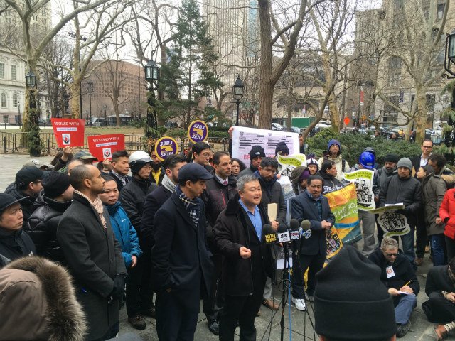 Dr. Dr. Do Lee, a member of the #DeliverJusticeCoalition who wrote his PhD thesis in environmental psychology on delivery cyclists at the CUNY Graduate Center, speaks at a rally outside City Hall in support of legislation that would legalize e-bikes and e-scooters.