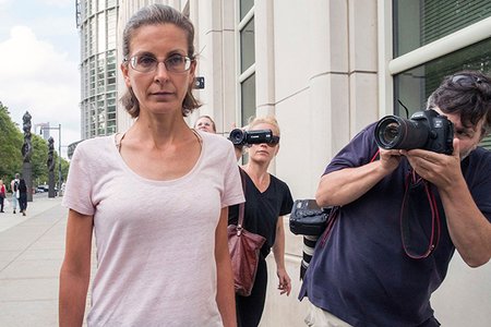 Clare Bronfman, left, leaves federal court, in Brooklyn.