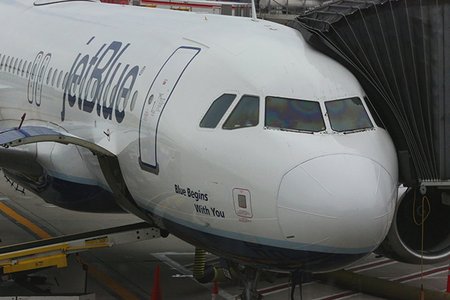 A JetBlue plane on the tarmac at JFK Airport in 2018