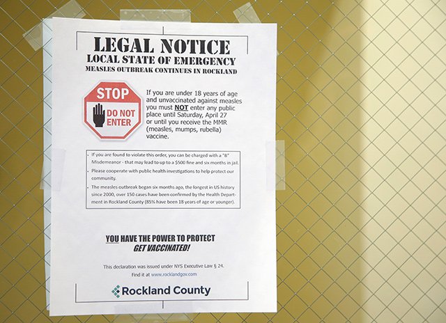 A sign from March 27, 2019 explaining the local state of emergency is displayed at the Rockland County Health Department in Pomona, N.Y.