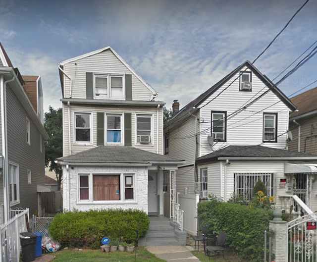 The Jamaica, Queens, house where police say Rizwan was shot, on the left