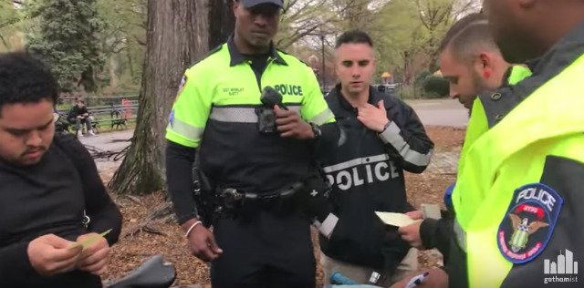 NYPD officers issue tickets to cyclists for lacking bells, and confiscate their bikes