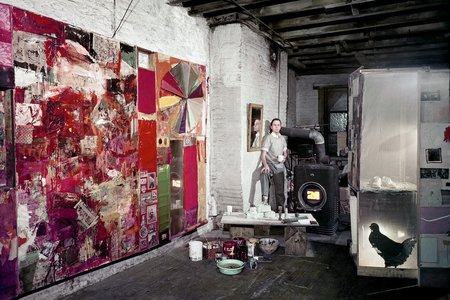 Rauschenberg in his Pearl Street studio, New York, March 1958. Works, left to right: Charlene (1954), Untitled (c. 1954), and a partial rear view of the second state of Monogram (1955–59, second state 1956–58). Photographer: Dan Budnik. Courtesy Robert Rauschenberg Foundation Archives, New York. © Dan Budnik<br/>