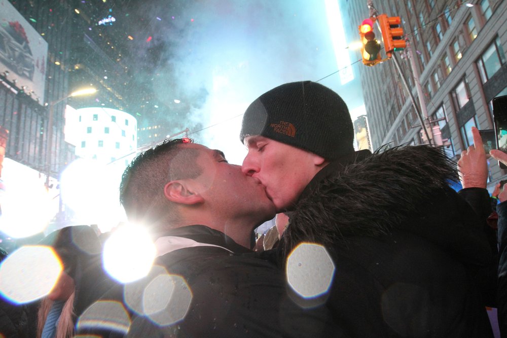 64faa4f03shutterstock_10044358b-jpg.jpeg Willam Moreno, from Denver, left, and his boyfriend James William Neely, from New York, kiss shortly after midnight in New York's Times Square (Tina Fineberg/AP/Shutterstock)