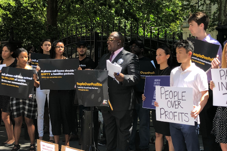 Dwayne Lee speaking outside City Hall yesterday before the bill passed