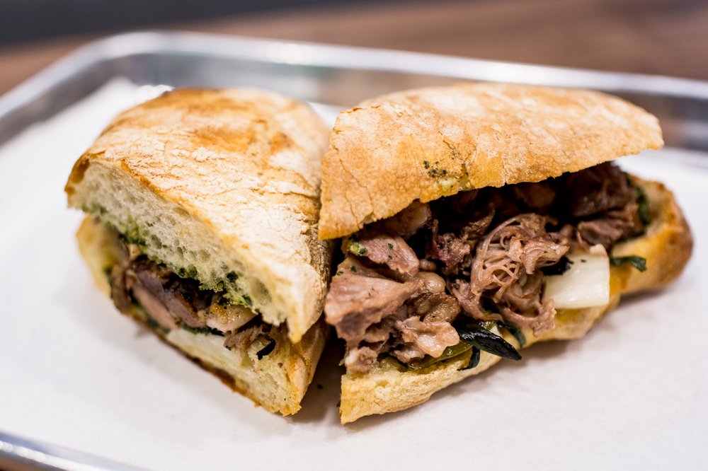 71a03f433110216untamedsandwiches3-jpg.jpeg The Nettleneck: braised lamb neck, walnut pesto, gruyere cheese, baby onions, and grilled onion tops<br>