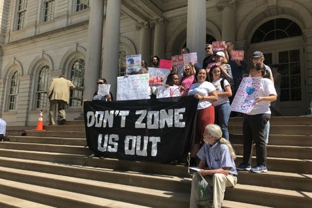 Protesters outside City Hall this morning before the votes