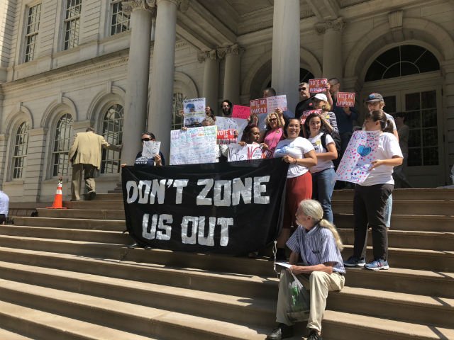 Protesters outside City Hall this morning before the votes