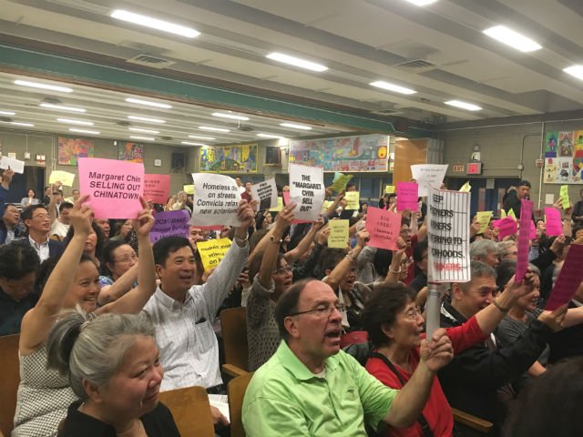 Chinatown residents booed and jeered as city officials tried unsuccessfully to lay out their plans for a new jail