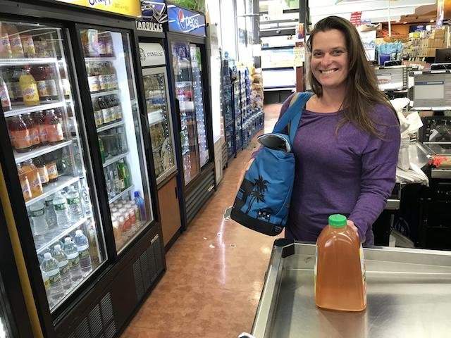 A supermarket shopper in Long Beach with a reusable bag.