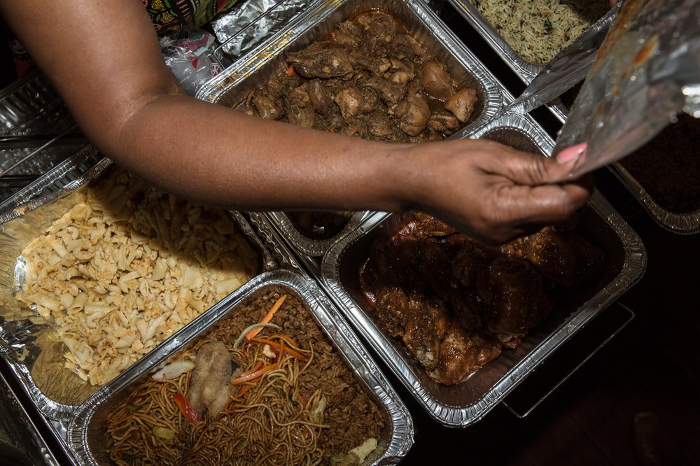 dcd6a42ab082718jouverttour-5-jpg.jpeg Noodles, chicken, and macaroni dishes at Carenage Mas camp.