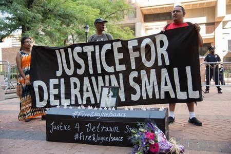 Activists, family, and friends call for the firing of officer Wayne Isaacs