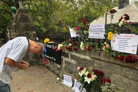 Yellow cab driver Johnny Ho pays his respects to Uber driver Fausto Luna