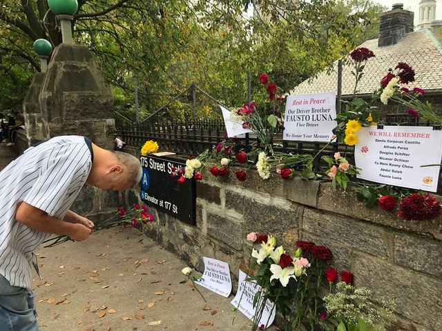 Yellow cab driver Johnny Ho pays his respects to Uber driver Fausto Luna