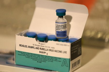 The measles vaccine, typically combined with the rubella and mumps vaccines.