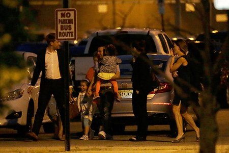 Pablo Villavicencio carries one of his daughters after being released from the ICE detention facility in Kearny, NJ this summer