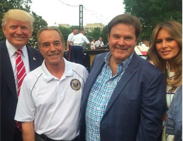 Rep. Chris Collins posing next to President Trump on the day he allegedly committed securities fraud.