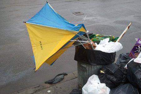 This trash can should really be full of broken snow shovels at this time of year.