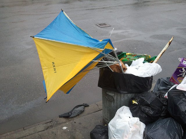 This trash can should really be full of broken snow shovels at this time of year.