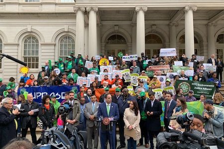 Environmental justice groups convened a rally outside City Hall on Thursday, ahead of the council's passage of building emission regulations.