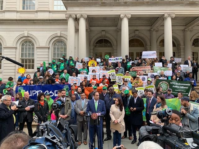 Environmental justice groups convened a rally outside City Hall on Thursday, ahead of the council's passage of building emission regulations.